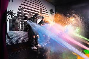 Guests make their way through Glow or Go's challenge rooms