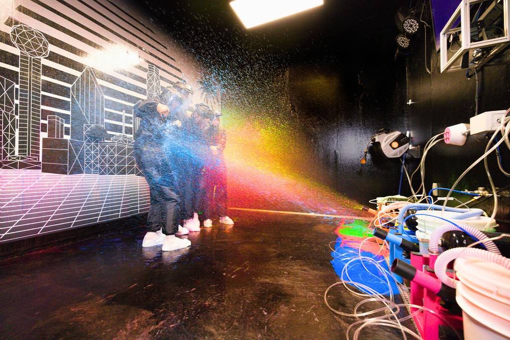 Guests make their way through Glow or Go's challenge rooms