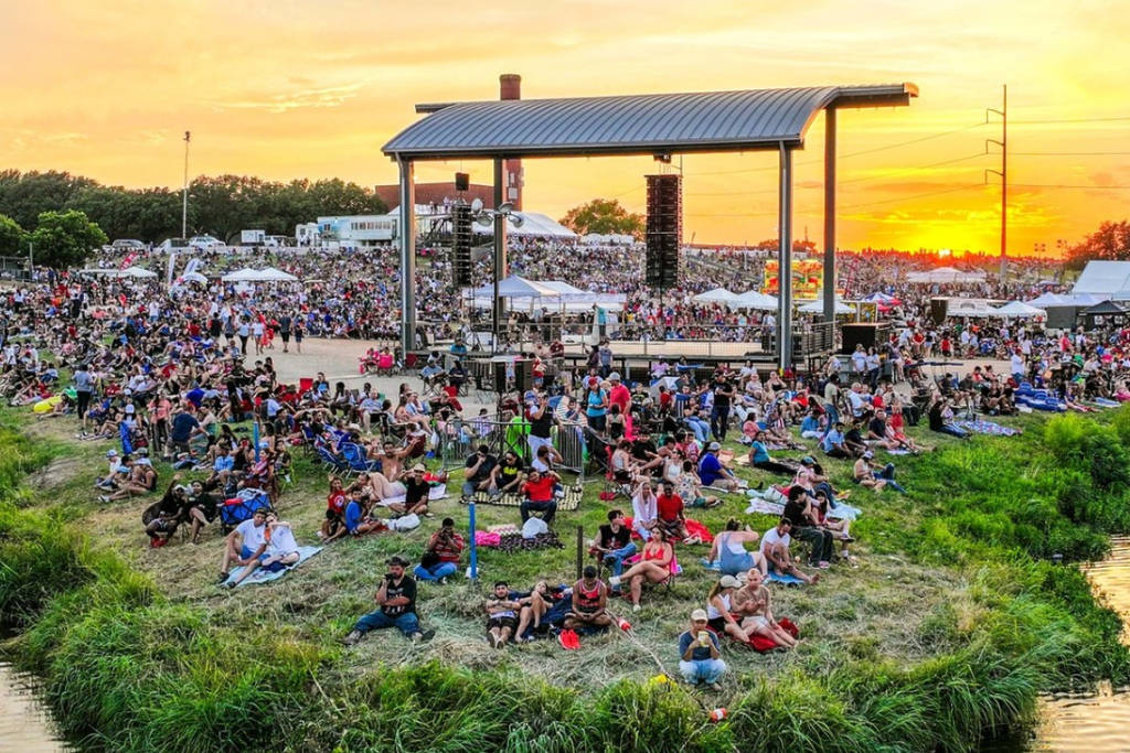 Image shows a crowd at the Panther Island Pavilion in Fort Worth for its Fourth of July celebration