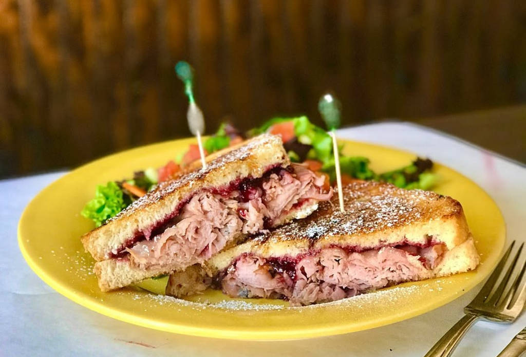 Image shows a sandwich from Hugs Cafe in McKinney, Texas.