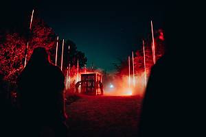 Guests navigate the spooky grounds at Forest of Shadows