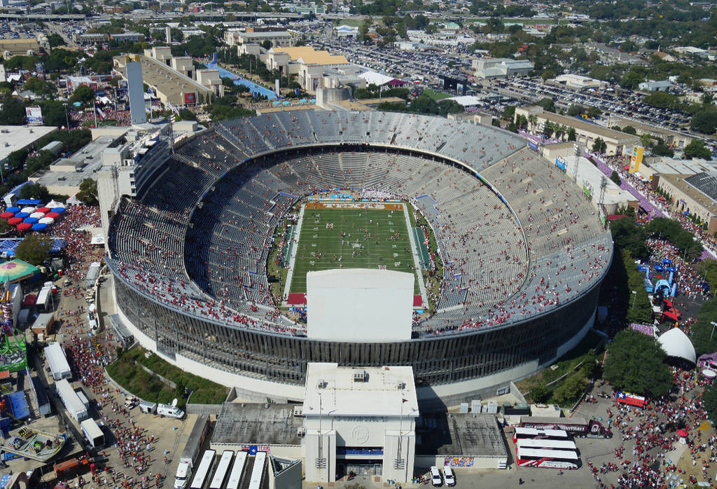 Image shows a football game taking place at the Cotton Bowl at the State Fair of Texas