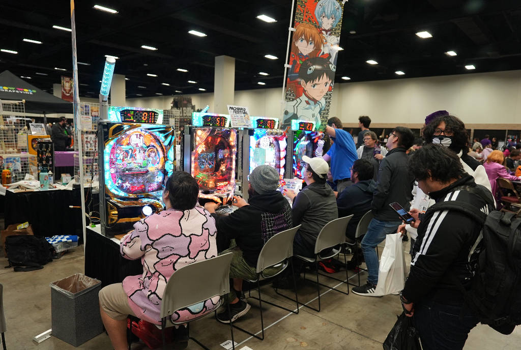 Image shows attendants of Anime Frontier in Fort Worth interactive with a gaming experience at the convention.