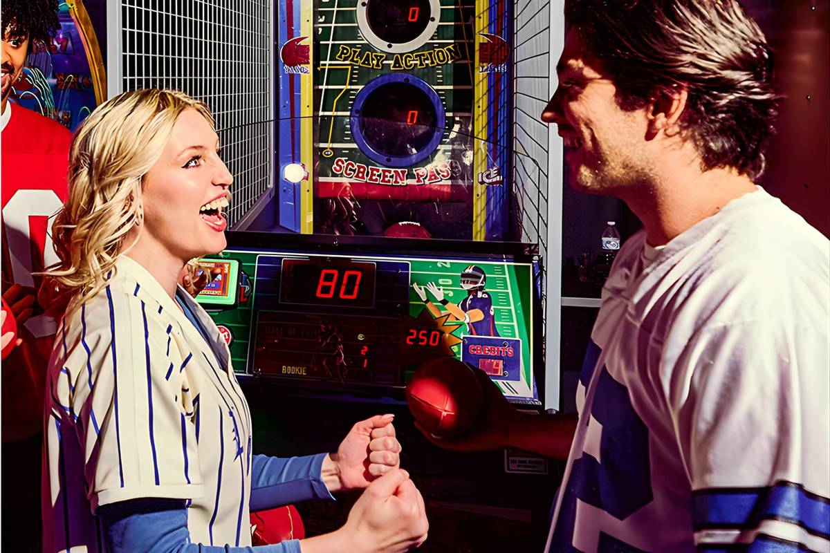 duo playing games at Dave & Buster's