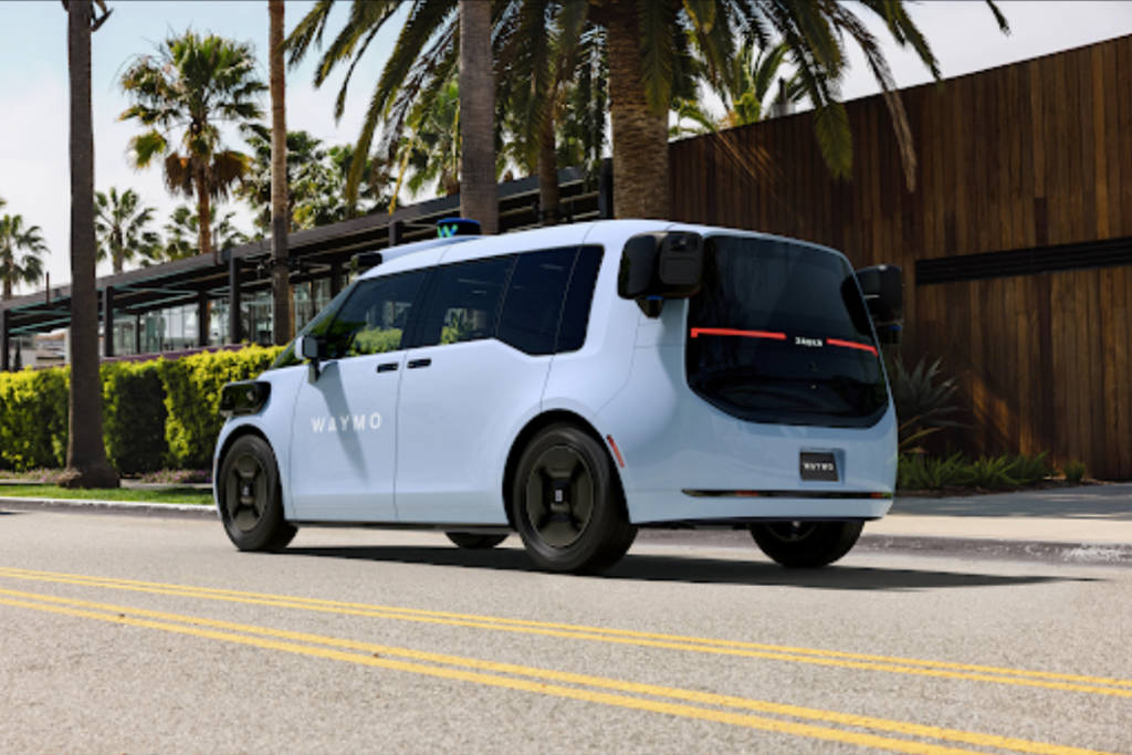 Image shows a Waymo van in transit.