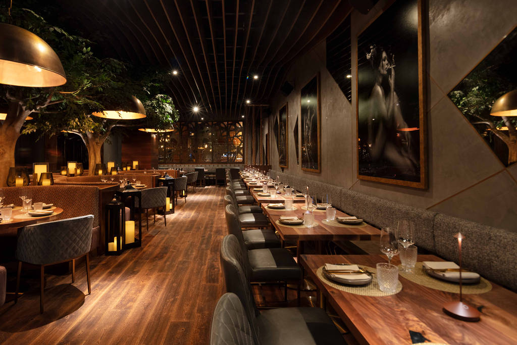 Image shows the dining area of Toca Madera in Houston.