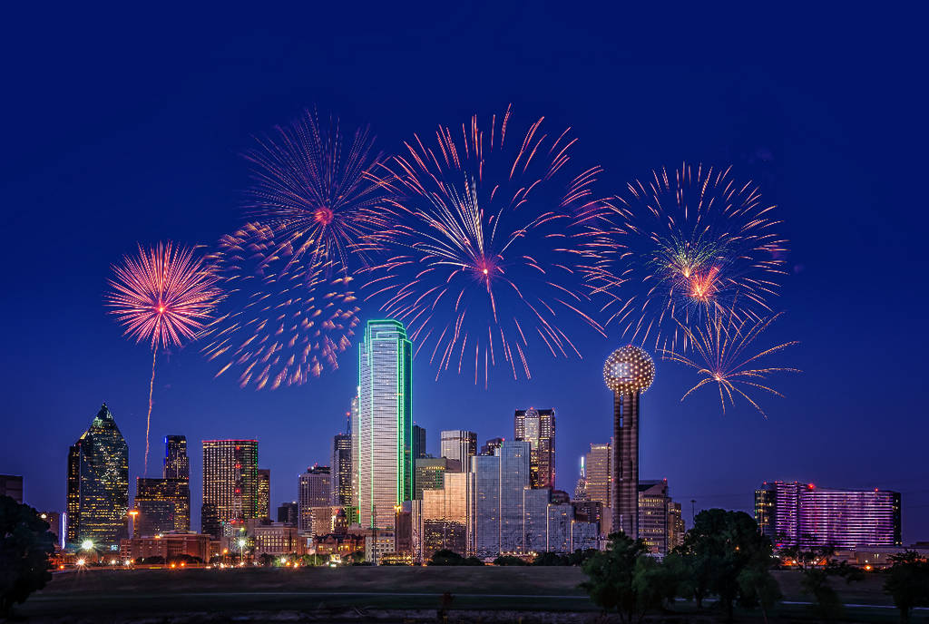 Image shows fireworks over the Dallas skyline.
