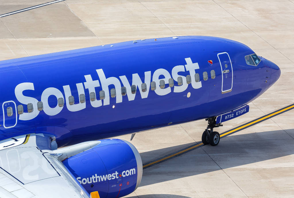 Image shows the tip of a Southwest Airlines aircraft stationary on the ground.