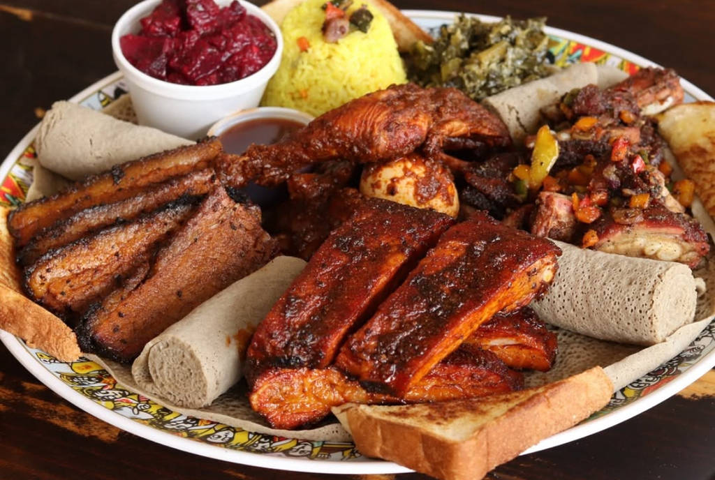 Image shows a plate of Ethiopian barbecue from Smoke N' Ash Barbecue in Arlington, Texas.