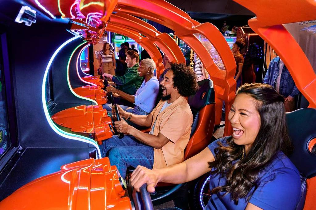 Dave and Buster's visitors playing arcade games
