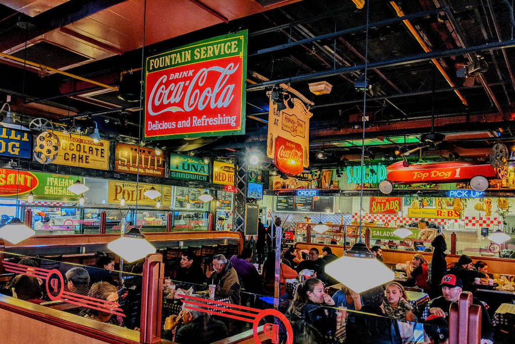 Image shows the interior of a Portillo's restaurant.