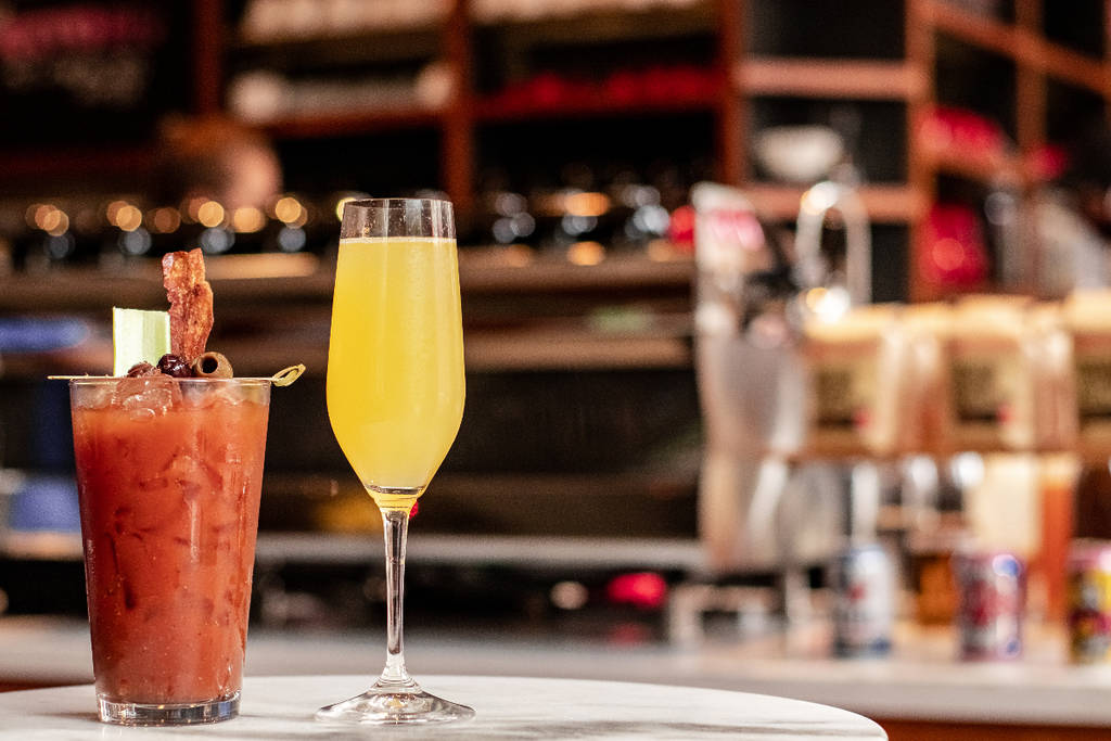 Image shows a tray of brunch drinks. 