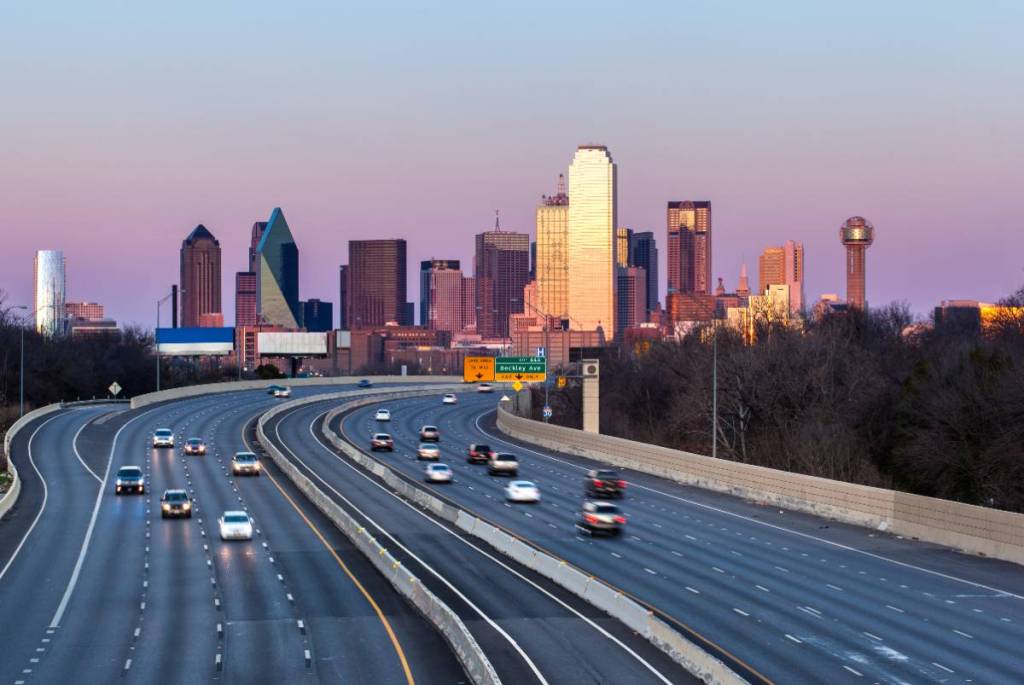 Image shows a Dallas highway with not a lot of vehicles. 