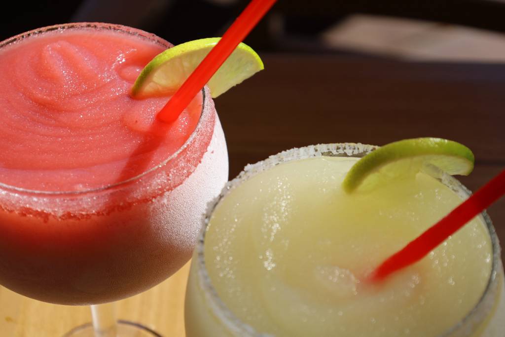 Image shows two different flavors of frozen margaritas.