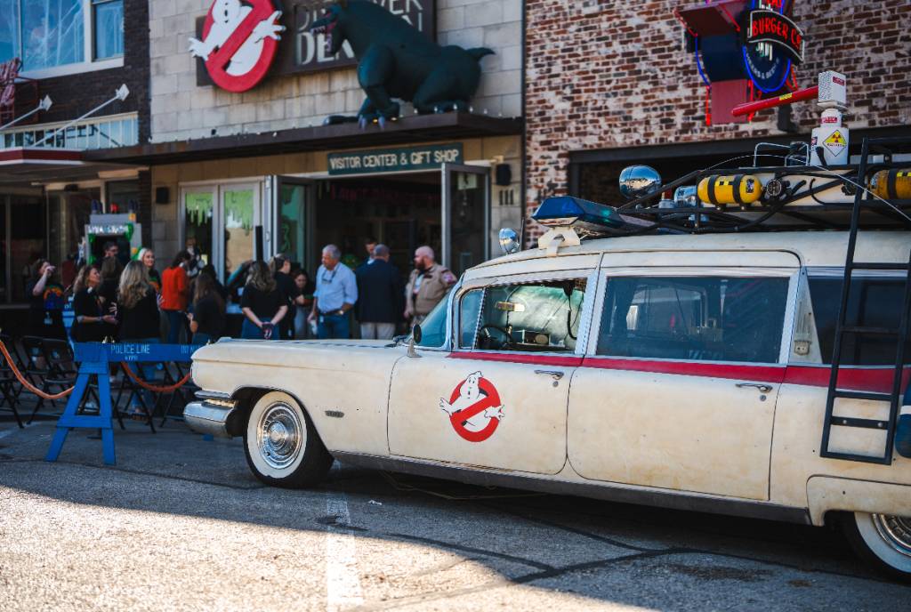 Image shows the Ghostbusters hearse parked outside an event for Denton Halloween.