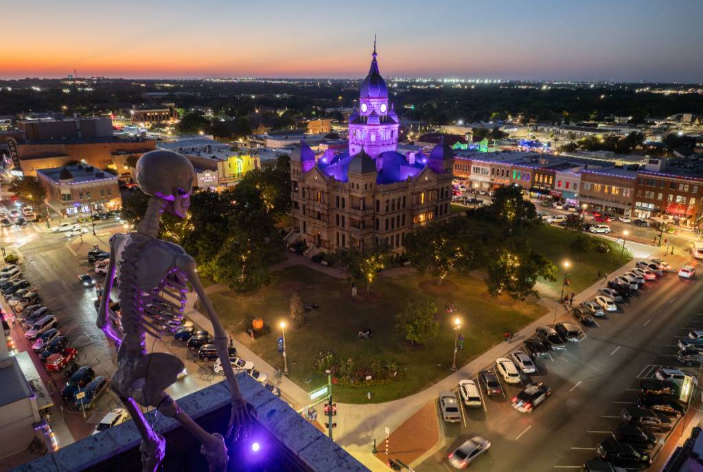 Image shows a skeleton installation overlooking the Denton courthouse.