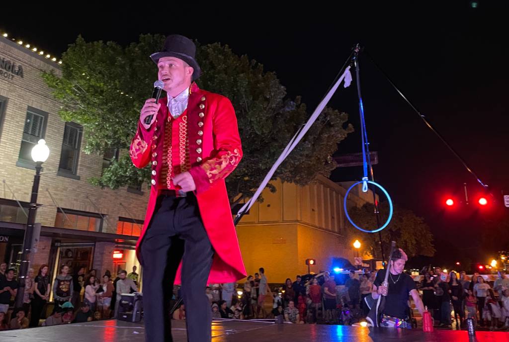Image shows a man dressed in a suit at the Wake the Dead Festival in Plano, Texas.