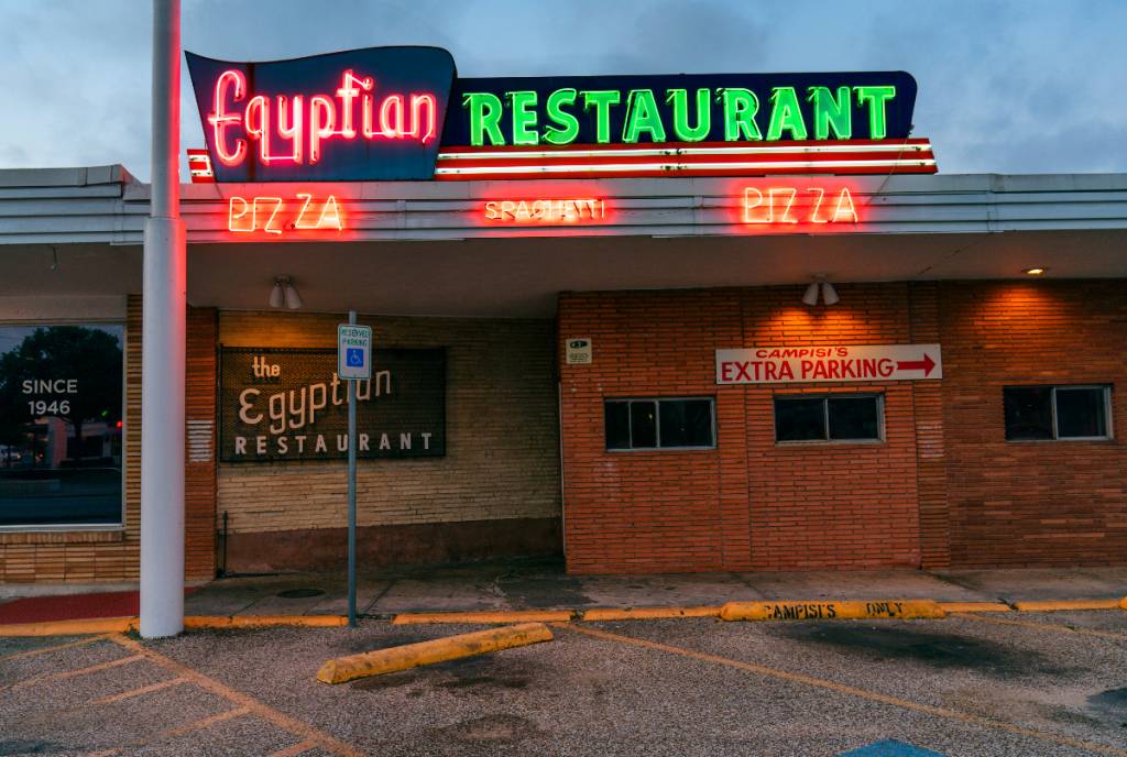 Image shows the neon signage at Campisi's restaurant in Dallas.