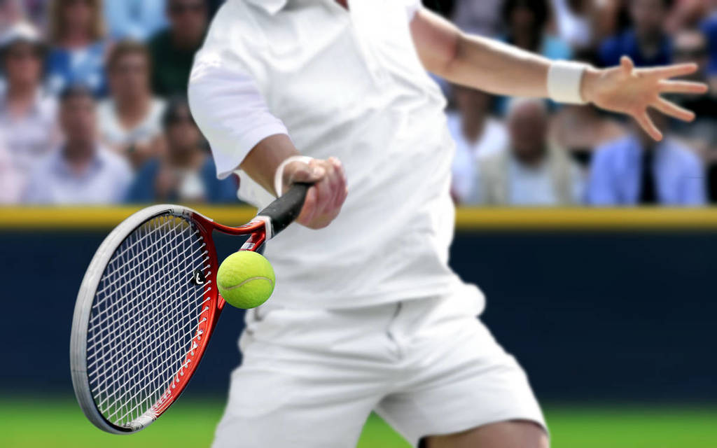 Male tennis player with forehand racquet swing hitting ball