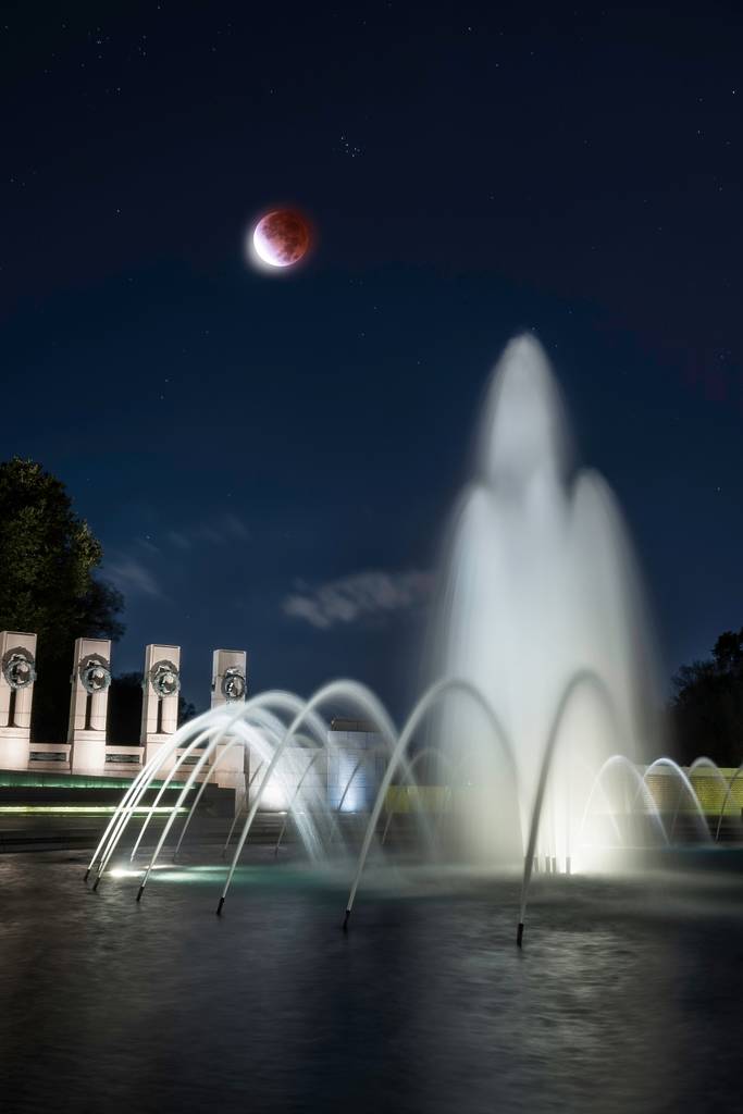 Lunar Eclipse over the World War II Memorial along the National Mall in Washington D.C.