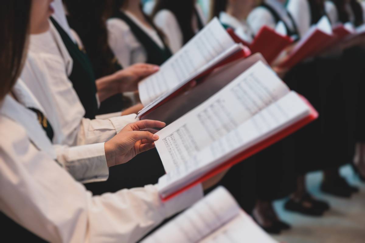 A close up shot of a choir singing