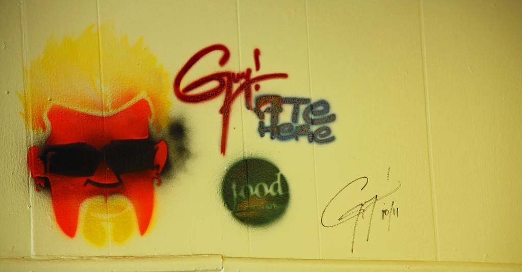 Guy Fieri's likeness on the wall