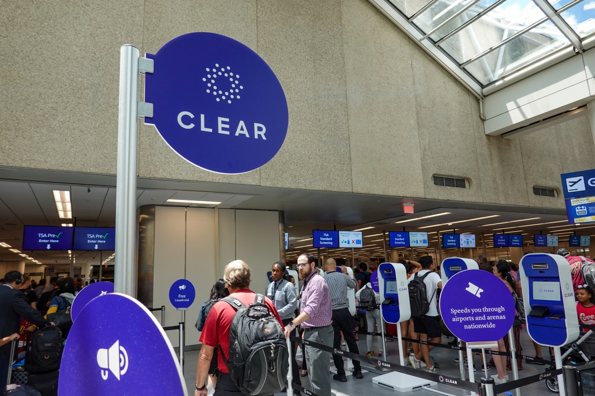 Airport security at a busy international airport with Clear, TSA precheck and TSA standard screening.