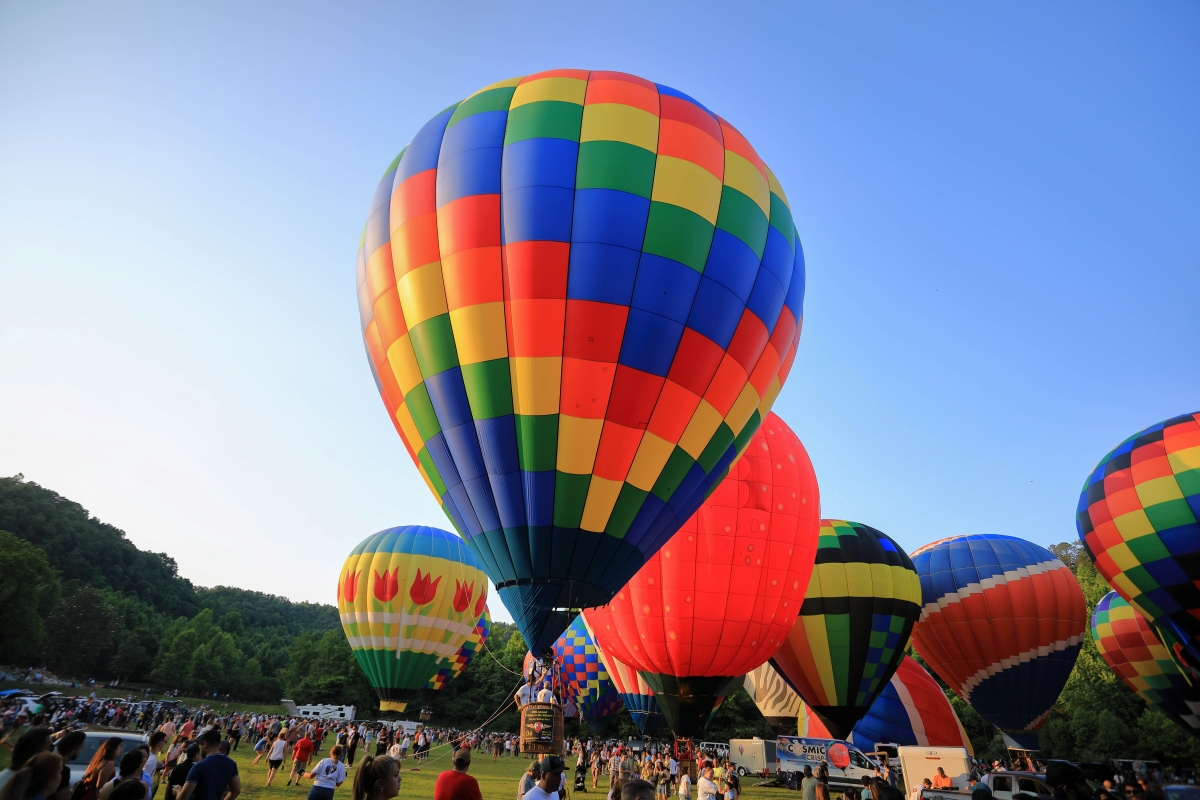 Many colorful balloons dot the landscape during a Hot Air Balloon Festival.