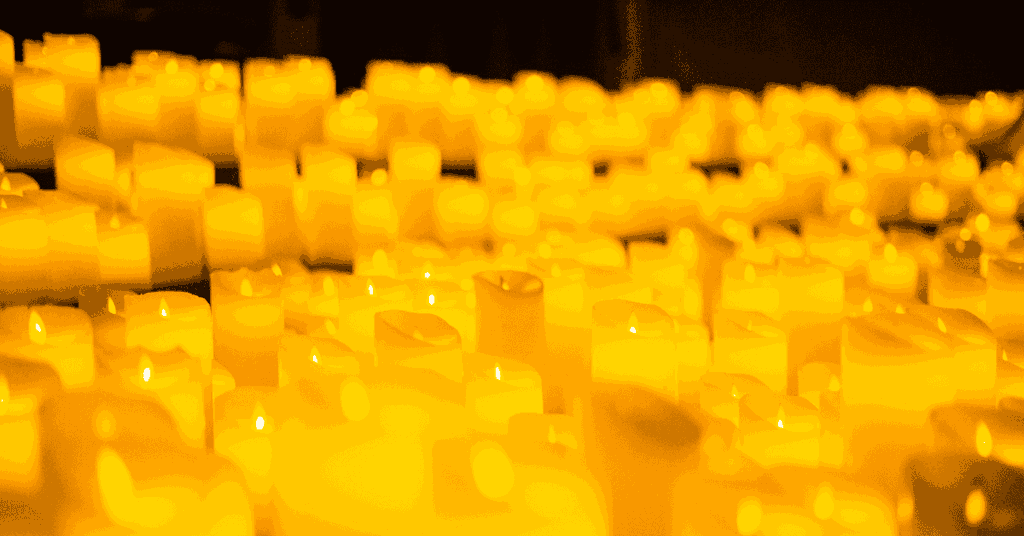 close-up of a sea of candles