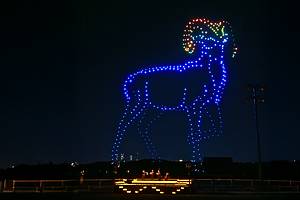 Drones illuminate the sky over a string quartet