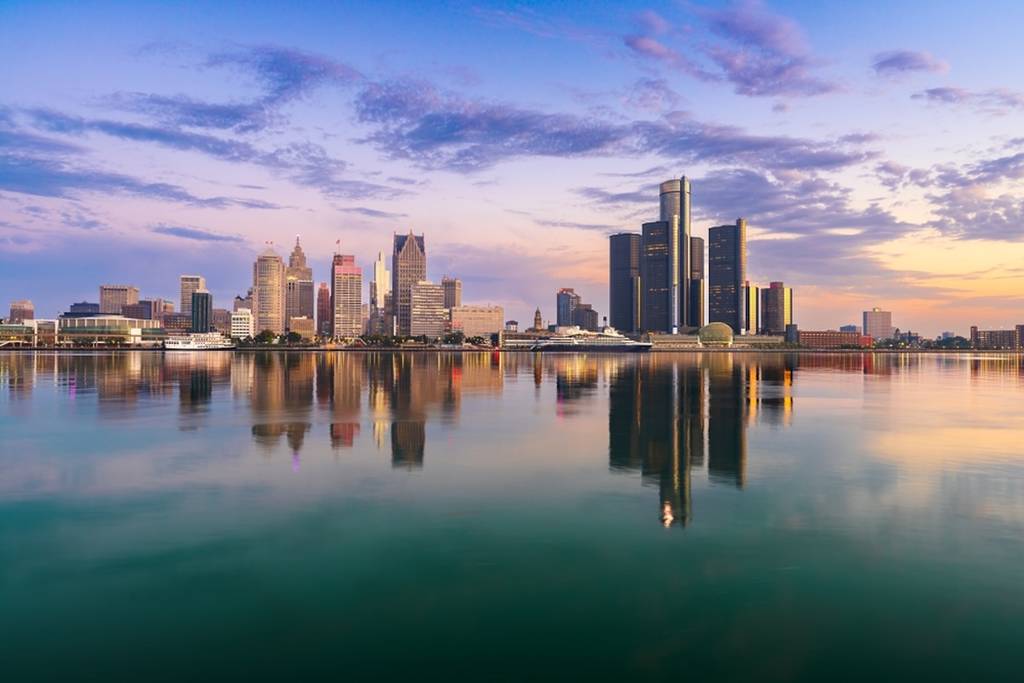 A skyline view of Detroit, MI at dawn.