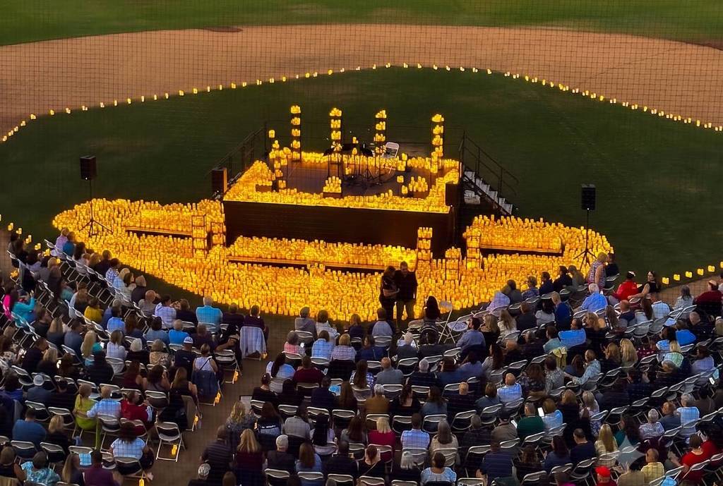 The audience waiting for the string quartet to take the stage at a Candlelight concert at UWM Field in Detroit