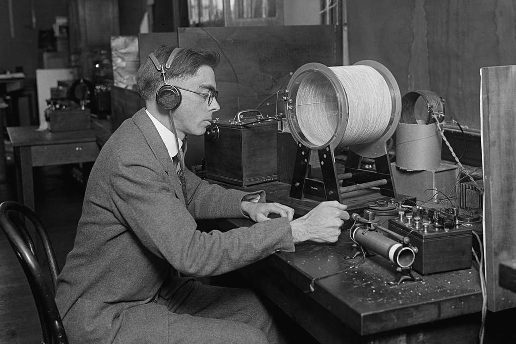 Scientist measuring radio wavelengths to regulate the new phenomena of commercial radio broadcasting. 1925