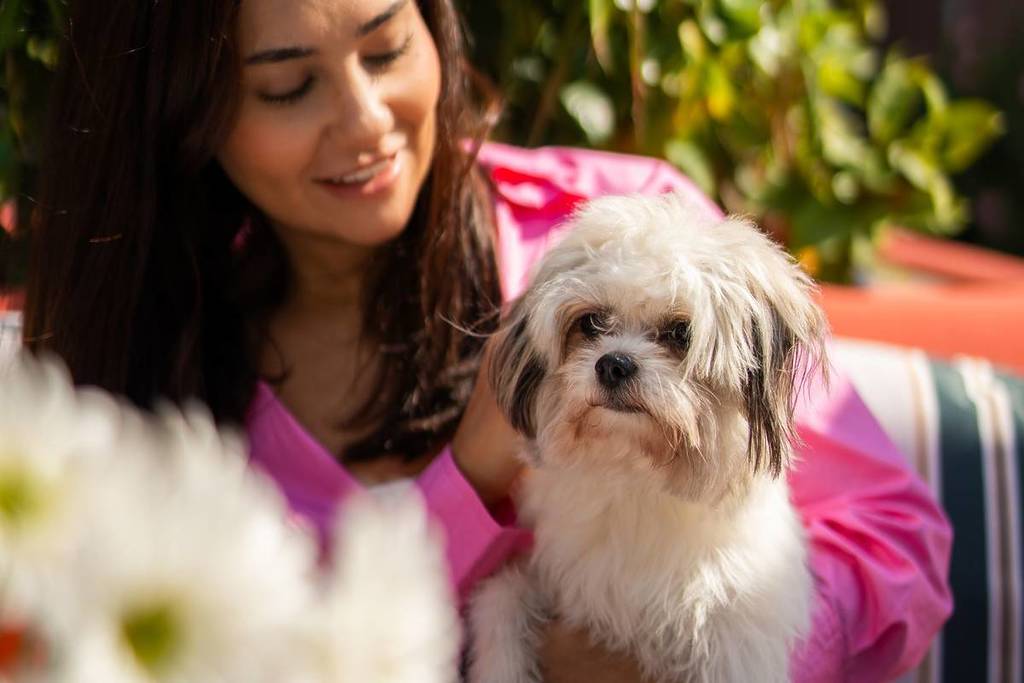 Women with dog at pet care panel Uptown Social Cafe