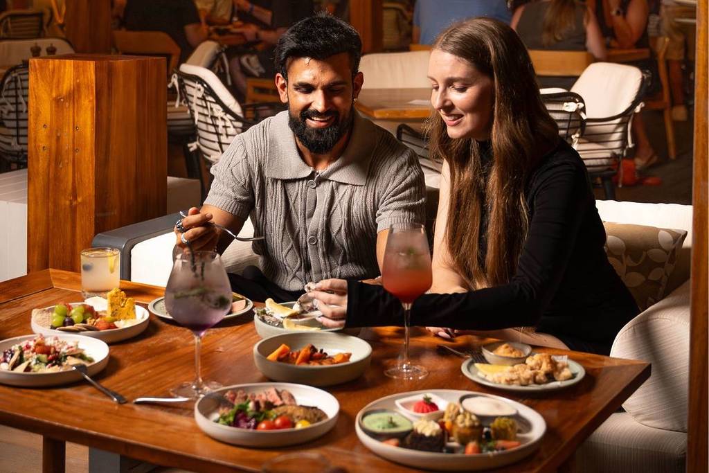 Couple enjoying lavish meals for Summer Restaurant Week - Jones The Grocer during Dubai Summer Surprises