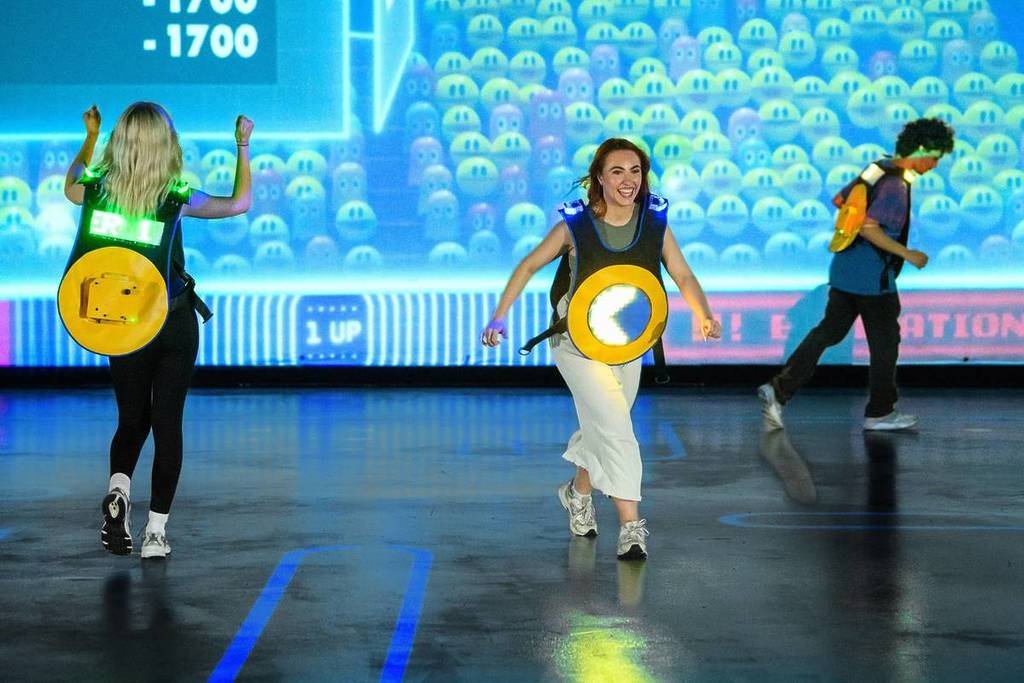 Contestants running around the Pac-Man field