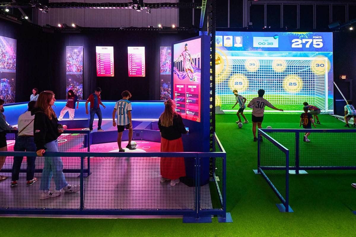 Aspiring footballers taking part in a live drill experience, learning to take shots like Messi