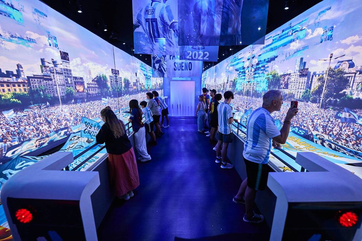 Guests at The Messi Experience using cutting edge technology to learn more about the iconic football player's life, one of the best things to do with teenagers in Dubai