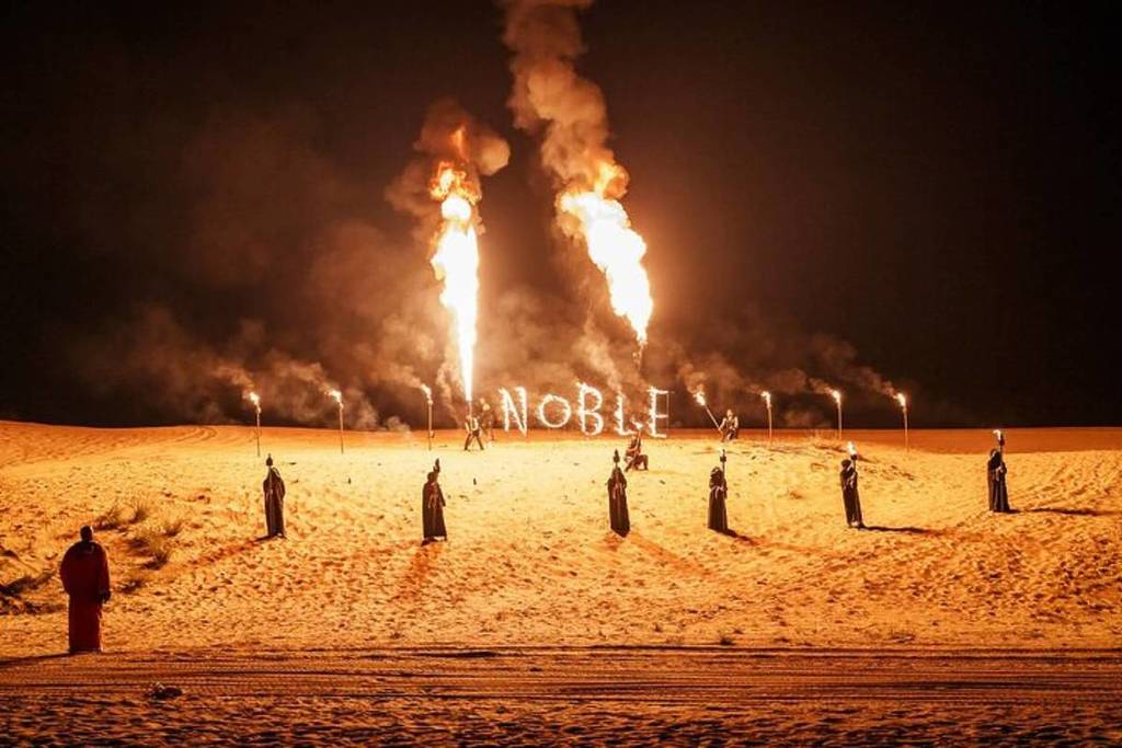 A fire show spelling out the word Noble, as part of the Noble Life Desert Dinner Show & Safari festivities
