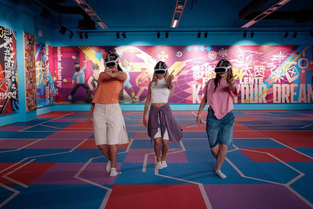 A trio of women wearing VR headsets