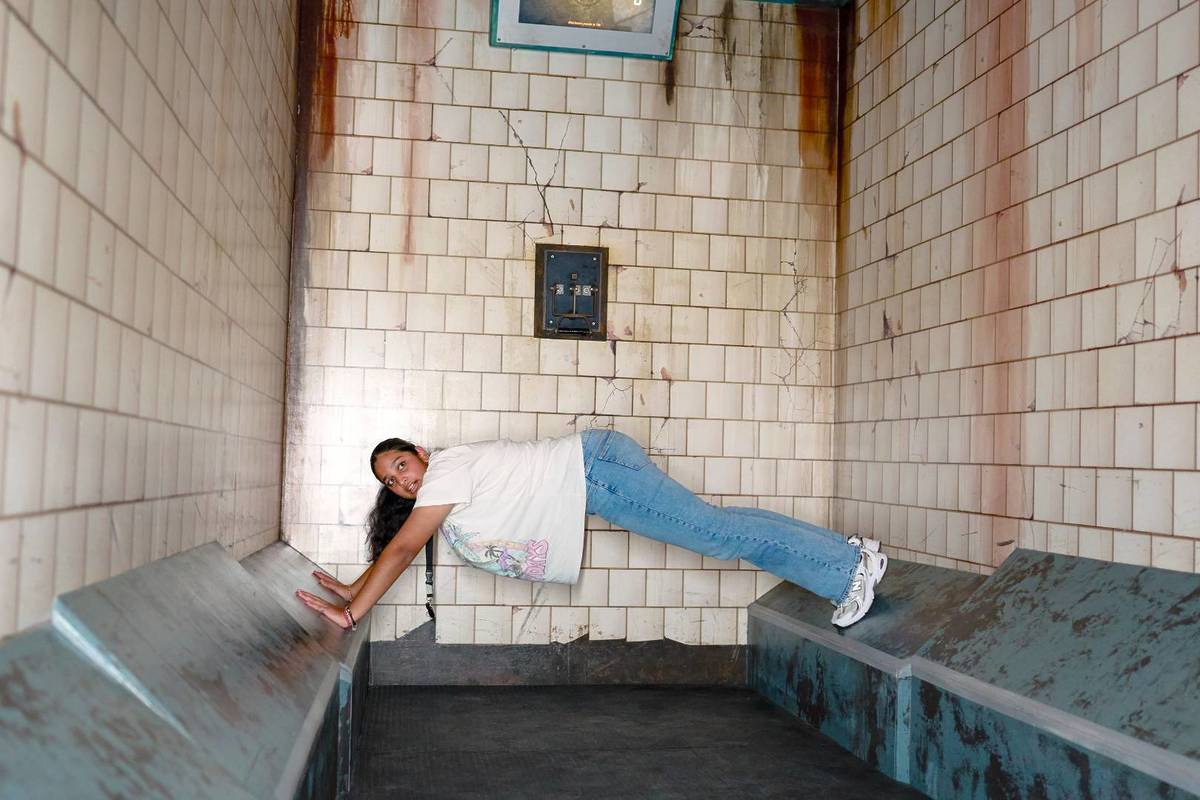 A participant using physical skills to escape Prison Island's cells