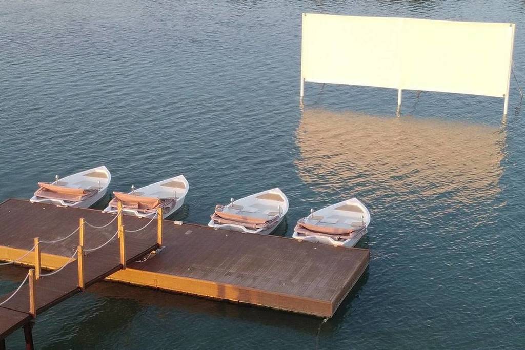 Watch a movie at Machia Velli's floating cinema where movies are screened when you are sitting on a boat off the docks