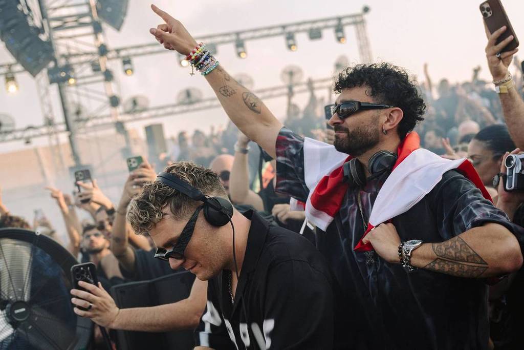ADRIATIQUE hyping up the crowd during one of the many energetic X by ADRIATIQUE Tour sets