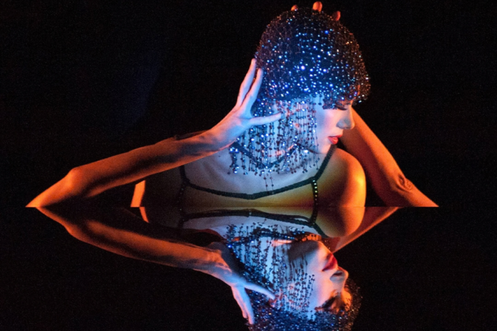 Crazy Horse Paris: The Dubai Edition - an optical illusion making the performer look mirrored