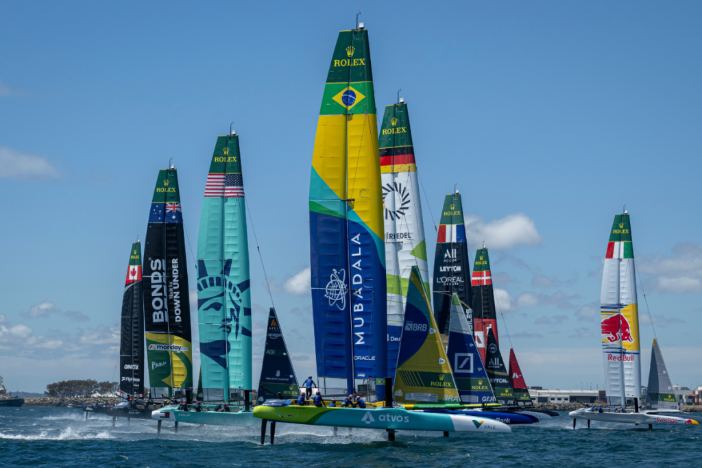 Emirates Dubai Sail Grand Prix competitors on the water, displaying sails representing their teams