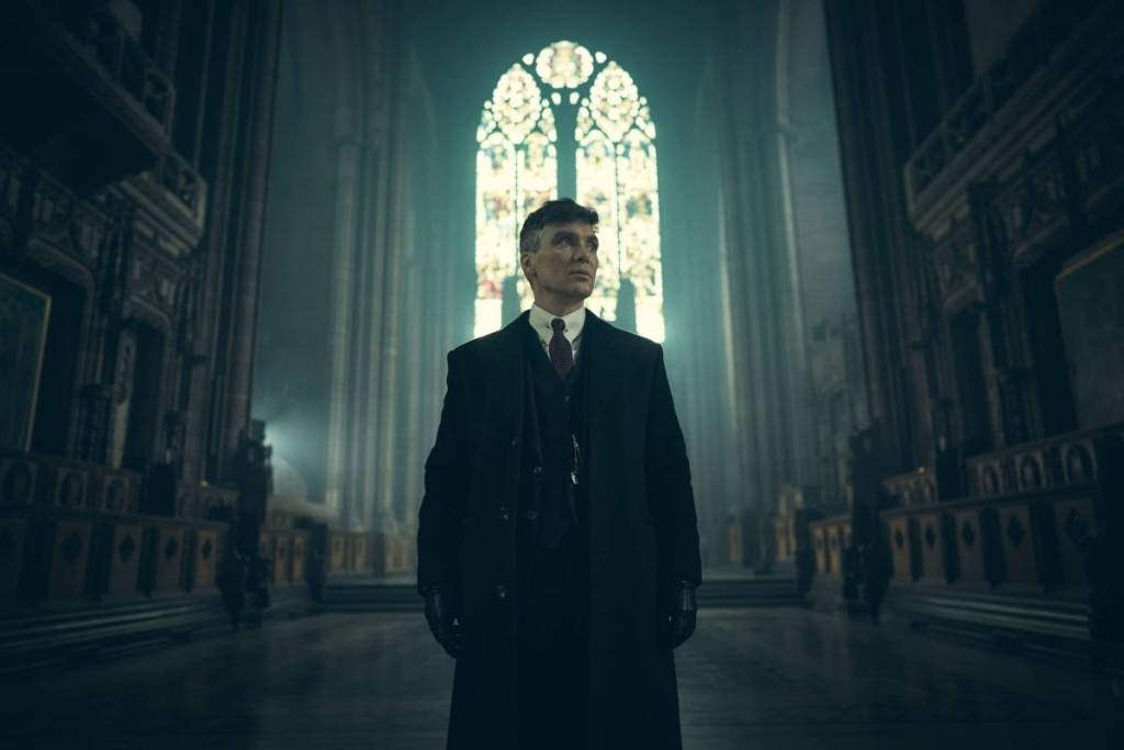 Tommy Shelby from BBC's Peaky Blinders series pictured inside a cathedral
