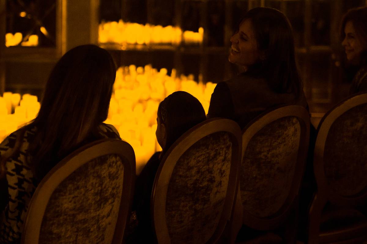 Audience members watching a Candlelight concert