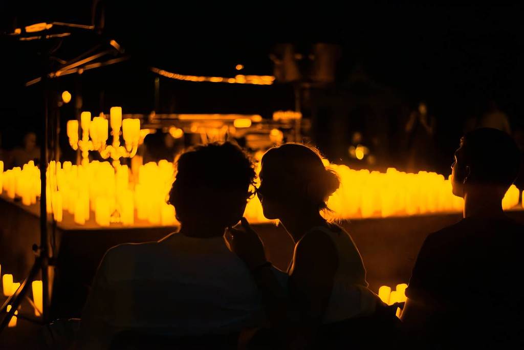 A couple talking to each other at a Candlelight concert