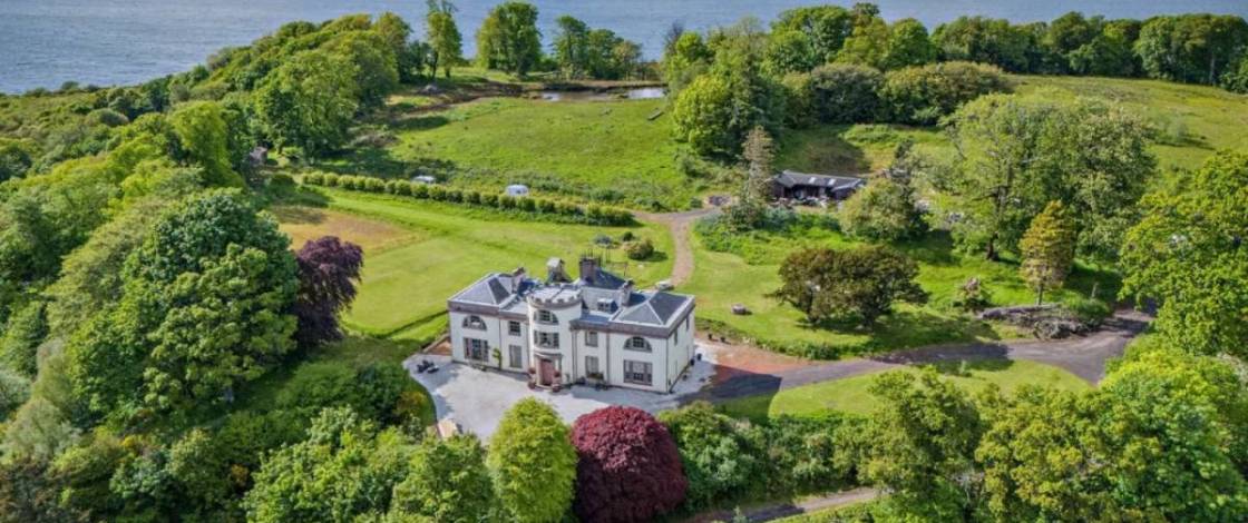 The six-bedroom mansion on its own private peninsula with stables, 22 acres, and a 16th-century tower for sale 55 minutes from Glasgow for £635,000