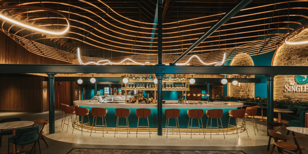 A brightly lit bar with turquoise accents
